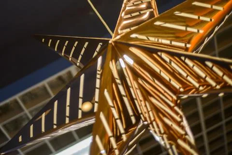 Lighting unit made in the form of a large gold star in the art Nouveau style, Stock Photos