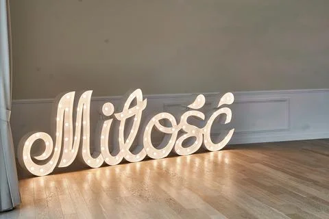 Lighting wedding decoration - Milosc - mean love in Polish Stock Photos