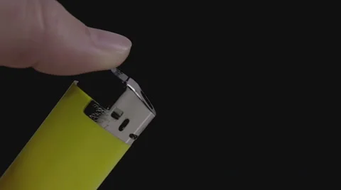 Lighting a yellow lighter slow motion Stock Footage 58761300