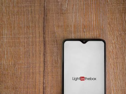 Lightinthebox app launch screen with logo on the display of a black mobile sm Stock Photos