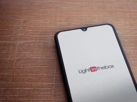 Lightinthebox app launch screen with logo on the display of a black mobile sm Stock Photos