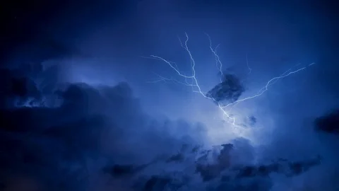 Lightning across blue sky at night Cinem... | Stock Video | Pond5