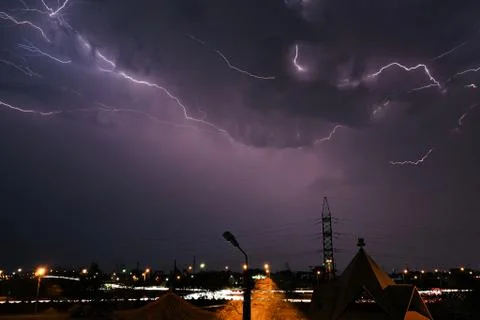 Lightning against the background of the sky Stock Photos