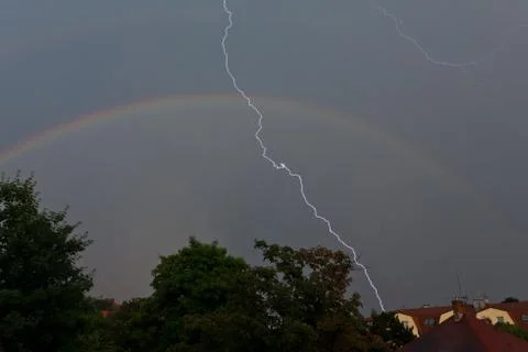 Lightning and rainbow Stock Photos
