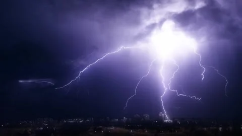 Lightning and thunder over the city at night Stock Footage