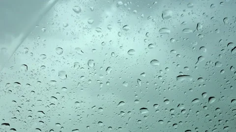 A Lightning at a Background.Rain on Glass Видео 64556417
