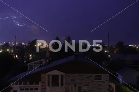 Lightning between clouds over the city