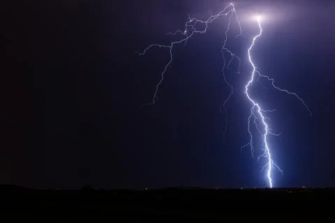 Lightning bolt strike from a storm Stock Photos