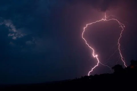 Lightning bolt striking in the sky from clouds Foto stock