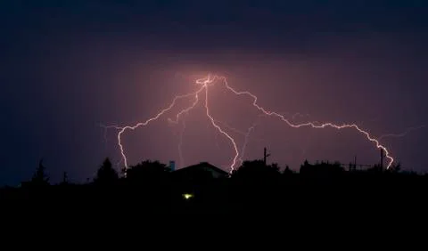 Lightning bolt striking in the sky from clouds Foto stock