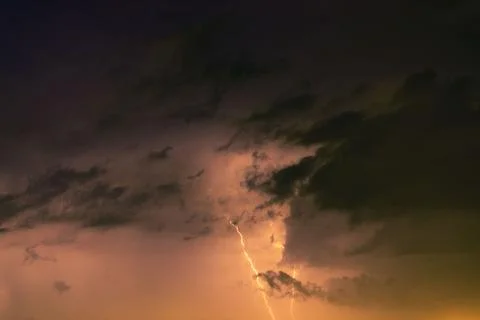 Lightning bolts against the backdrop of a thundercloud. 스톡 사진