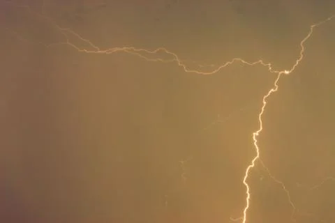 Lightning bolts against the backdrop of a thundercloud. 스톡 사진