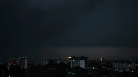 Lightning bolts flashes composition with view of night city sky with clouds. Видео 169691847