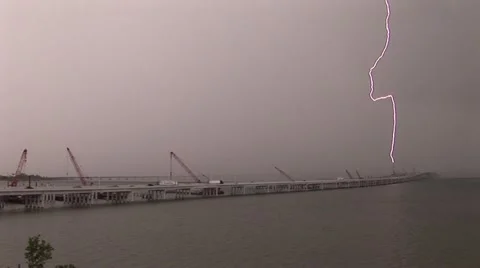 Lightning bolts strike bridge cranes Video stock 12574240