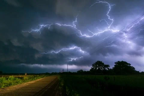 Lightning branches between the clouds of a Nebraska thunderstorm Stock Photos