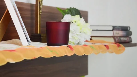 Lightning up the candle in front of the deceased picture. Stock Footage 70198332