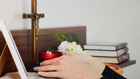 Lightning up the candle in front of the deceased picture Stock Footage 70198360