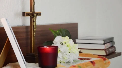 Lightning up the candle in front of the deceased picture. Stock Footage 70198384