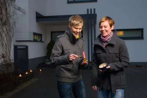 Lightning a candle Stock Photos