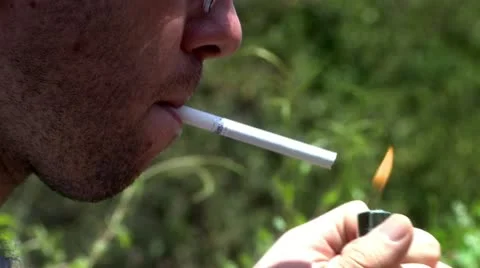 Lightning Cigarette in a Park Stock Footage 22418228