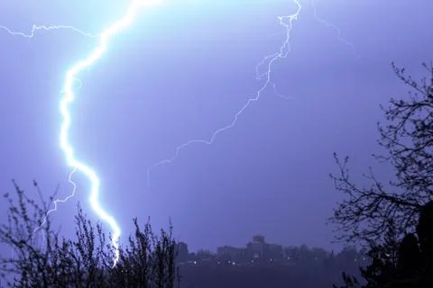 Lightning in the clouds on the horizon Stock Photos