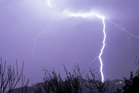 Lightning in the clouds on the horizon Stock Photos