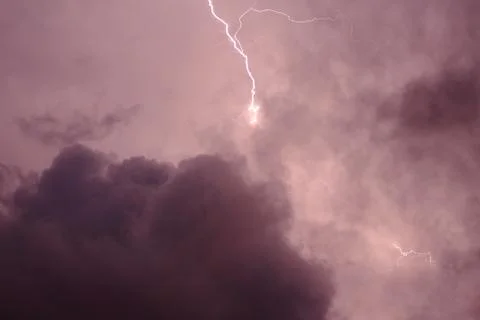 Lightning in the clouds on the horizon Stock Photos