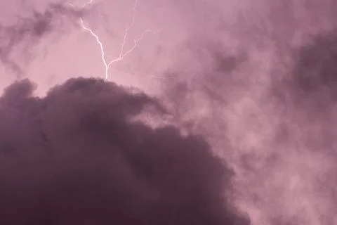Lightning in the clouds on the horizon Stock Photos
