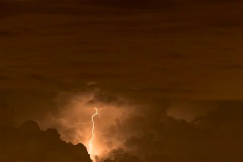 Lightning in the clouds on the horizon Stock Photos