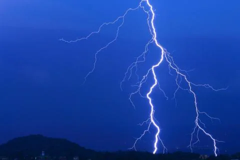 Lightning in the clouds on the horizon Stock Photos