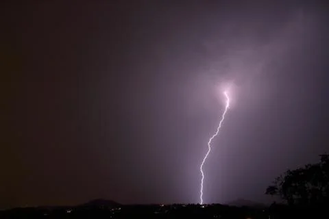 Lightning in the clouds on the horizon Stock Photos