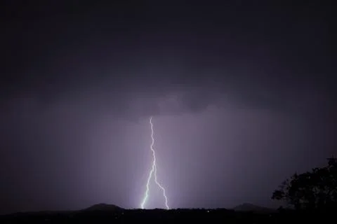 Lightning in the clouds on the horizon 库存照片