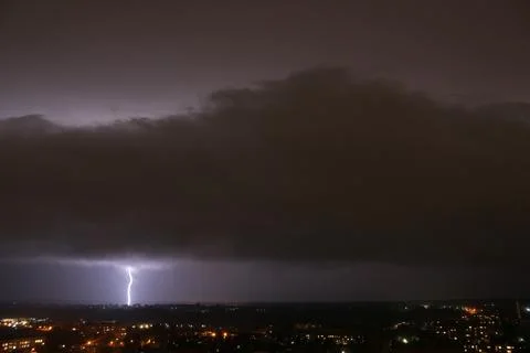 Lightning that comes out of the clouds in the sky and touches the ground. Stock Photos