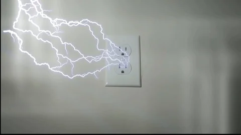 Lightning comes out of wall socket Stock Footage 92384788