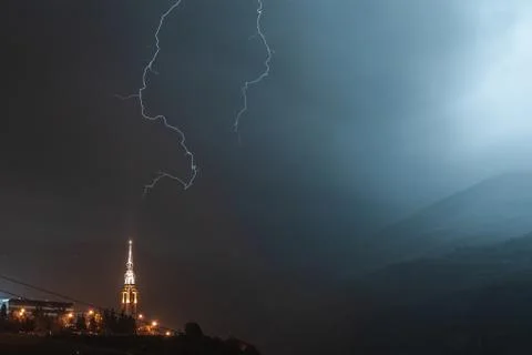 Lightning during a storm on a tower in a mountain resort Stock Photos