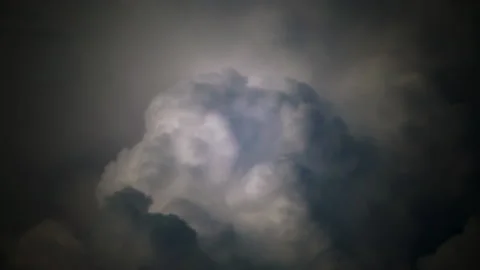 Lightning Flash Across Heavy Clouds During a Dramatic Night Storm Stock Footage 342353364
