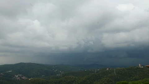 Lightning flash on cloydy sky over hills, Baecelona Stock Footage 99913937