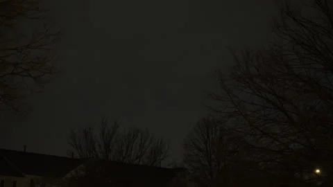 Lightning flash illuminating the night sky during a powerful thunderstorm. Video stock 341544964