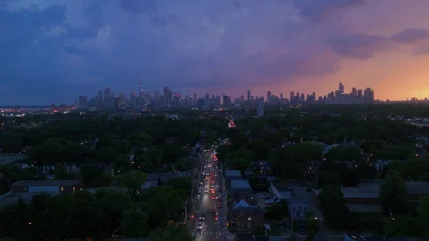 Lightning flashes across the Toronto skyline from a thunderstorm at sunset Stock Footage 315699449