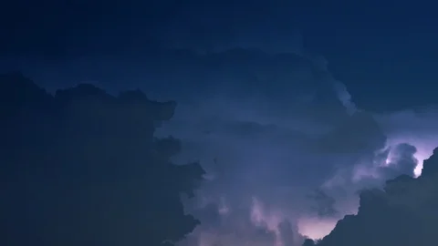 Lightning flashes in billowing night clouds ZOOMING IN Stock Footage 108487210