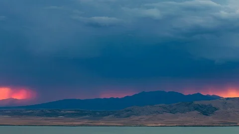 Lightning flashes on horizon during sunset Stock Footage 92187945