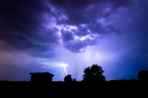 Lightning flashes over the night sky during thunderstorm. Foto stock