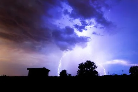 Lightning flashes over the night sky during thunderstorm. Foto stock