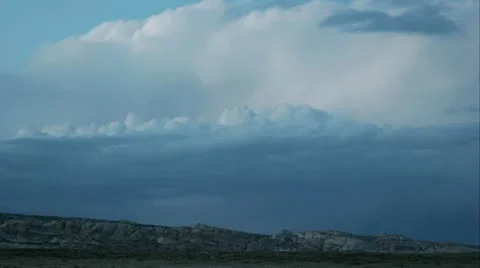 Lightning flashes from swiftly moving storm clouds over Goblin Valley State Video stock 11520812