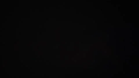 Lightning flashes through dark storm clouds. Video stock 278523421