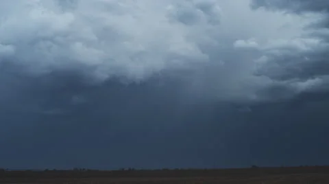 Lightning flashes from a time-lapse storm over a prairie landscape Stock Footage 59261753