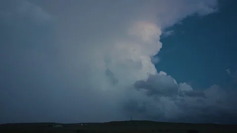Lightning Flashes In A Towering Storm Cloud In Soft Dusk Light Stock Footage 250288721