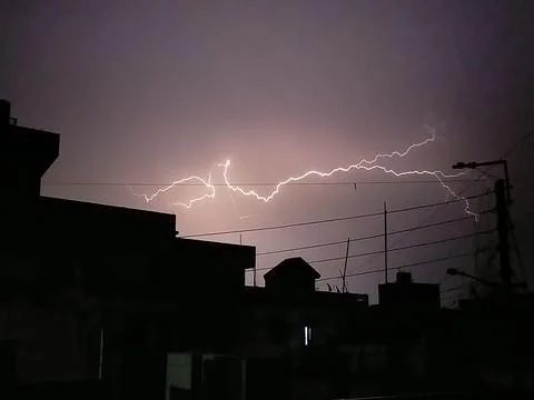 Lightning flashing in the sky Stock Photos