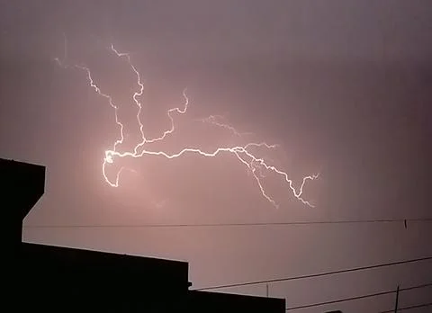 Lightning flashing in the sky Stock Photos