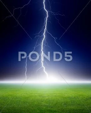 Lightning, green field Stock Photos